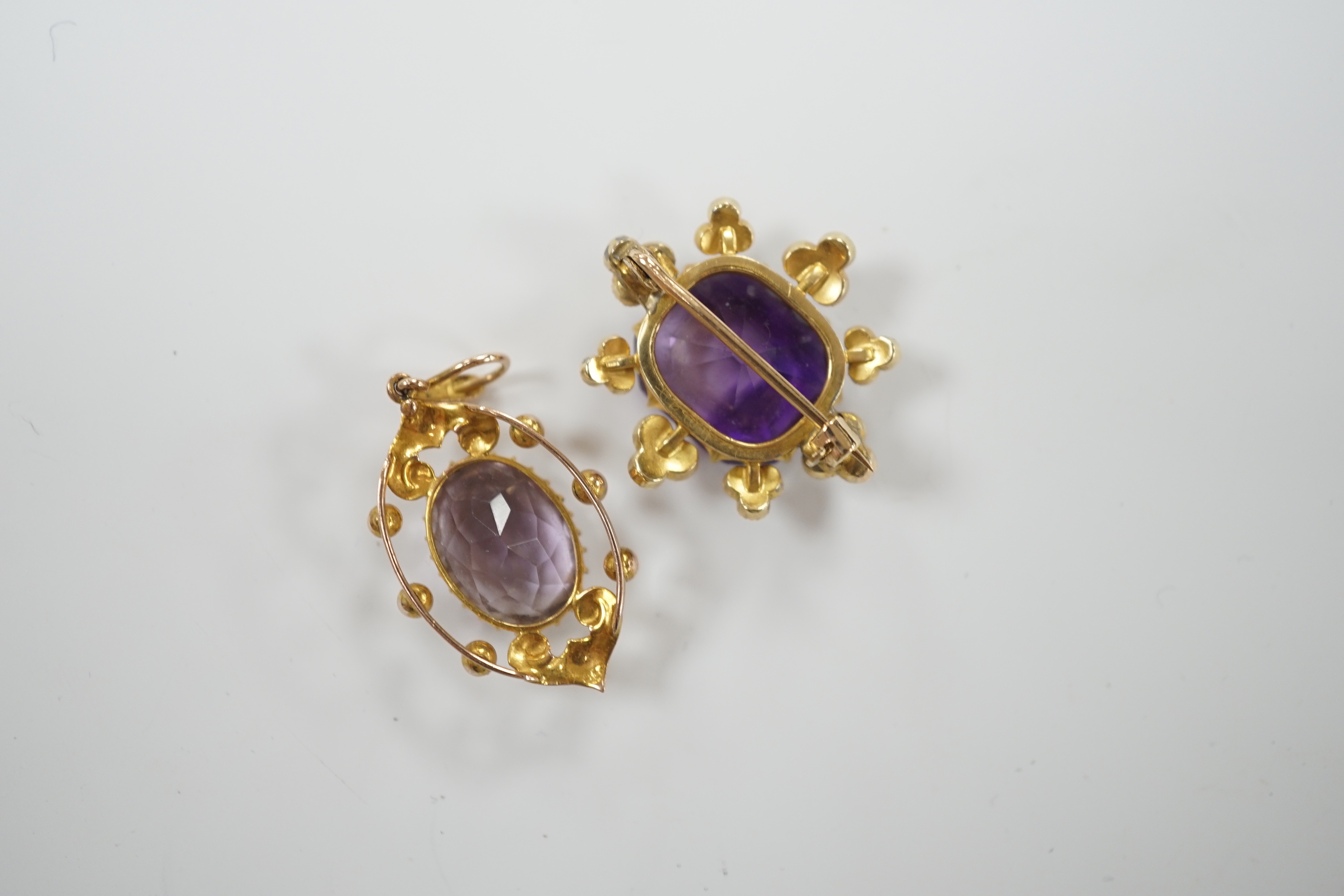 An early 20th century yellow metal, amethyst and seed pearl set brooch, 26mm and a similar pendant, gross weight 9.9 grams.